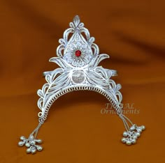 Lord Krishna crown is the traditional symbolic form of headgear worn by Lord Krishna(all deity or goddess ). It represents power, legitimacy, victory, triumph, honour, and glory, as well as immortality, righteousness, and resurrection Vintage antique design handmade 925 sterling silver hat(crown)mukut for little god statues, best Krishna mukut, silver god costume from India. Metal-sterling silver Item type-Mukut(crown). Weight-76.360 grams. Height-3.6 inches. Width-3.7 inches approx. Stamped-925 Silver Mukut Design For God, Traditional Ceremonial Headpieces For Festivals, Traditional Round Crown Wedding Headpiece, Traditional White Ceremonial Headpiece, Traditional Wedding Headpiece With Round Crown, Traditional Tilla Headpieces For Festivals, Ceremonial Crown Headpiece For Festivals, Ceremonial Tall Crown Headpiece For Festivals, Wedding Crown Headpiece For Festivals