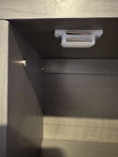 the inside of a metal cabinet with two handles