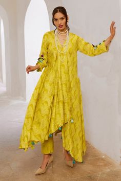 Lemon green asymmetric tunic with floral fantasy print and tassel embellishments. Comes with pant. - Aza Fashions Spring Anarkali Kurta With V-neck, Summer Anarkali Set With V-neck, Spring Asymmetrical Sets, Festive V-neck Kurta For Spring, Spring V-neck Sets With Dupatta, Spring Festive V-neck Kurta, Festive Spring V-neck Kurta, Bohemian Straight Kurta Sets For Spring, Spring Bohemian Straight Kurta Sets