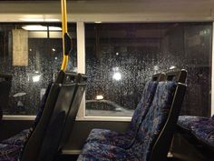 the seats are covered in rain on the bus