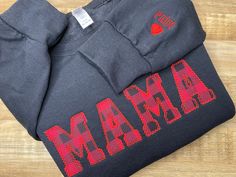 "Custom Mama Embroidered Sweatshirt with name, Mama sweatshirt, Mama Embroidered Sweatshirt, Boy mom, Personalized mom gift,  Mama Sweatshirt,  gift for mom, Mama Embroidered Sweatshirt, Embroidered Mama Sweatshirt, Embroidered Mama, Mama Sweater, Holiday Sweater, Mother's Day Gift  { D E T A I L S } The Embroidered Mama Sweatshirts will make the perfect gift for mom. This sweatshirt comes in black with a buffalo plaid applique \"MAMA\" design. You also have the option to add up to four names an Mama Embroidered Sweatshirt, Mama Design, Mama Sweater, Valentine Gifts For Mom, Fur Mama, Personalized Gifts For Mom, Mama Sweatshirt, Embroidered Sweatshirt, Sweatshirt Christmas