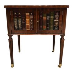 an old wooden cabinet with many books on it