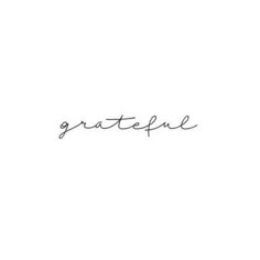 the word grateful written in cursive handwriting