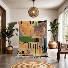 a living room with rugs and potted plants