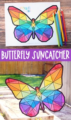 a butterfly suncather made out of stained paper and colored crayon pencils