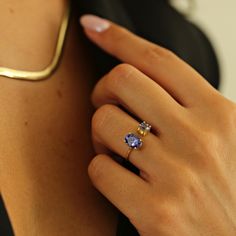 ♡ PRODUCT FEATURES ♡ * Material Selection: 8K and 18K Solid Gold * Color Selection: Yellow Gold, White Gold, Rose Gold * 1 oval brilliant cut, Tanzanite weight 0.96 ct from Tanzanite. * 1 rounded cut, Tanzanite weight 0.30 ct from Tanzania. * Weight: 1,8 Gr ♡ SUPER POWER ♡ Tanzanite This gorgeous blue-purple gemstone is linked with a variety of positive and mystical properties. Tanzanite is believed to have the power to transform negative thoughts and energies into positive ones, stimulating intuition and perception. It is one of the most valuable of all metaphysical crystals for spiritual exploration. It brings together all aspects of communication and psychic power. It is particularly useful in combining the mind and heart with high vibrational energy, teaching a person to live with an e Engagement Ring Purple, Crystal Wedding Ring, Wedding Ring Simple, Tanzanite Jewelry, Material Selection, Ring Purple, Psychic Powers, Tanzanite Ring, Ring Simple