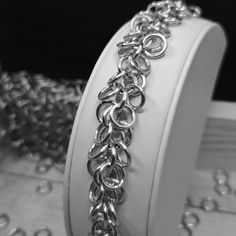 A lovelychain bracelet made of bright Aluminum rings in a shaggy pattern. Great for adding charms to or just on its own. This bracelet measure 7 1/2 inches from clasp to the end of the pattern with another inch of chain afterwards to allow for adjustment. I use Aluminum because it is resistant to fading, super light, and easy to clean. To clean, simply use a soft toothbrush or scrubber and use Dawn dish soap. Gently scrub and rinse, pat the excess water off and let air dry. Metal Link Bracelets With Rolo Chain, Metal Bracelets With Jump Ring For Jewelry Making, Metal Chain Link Bracelet For Jewelry Making, Metal Link Bracelets With Jump Ring, Handmade Chain Link Bracelets, Jump Ring Chain Link Jewelry For Jewelry Making, Elegant Chain Link Bracelets With Jump Ring, Chain Link Bracelets For Jewelry Making, Metal Bracelets With Rolo Chain As Gift