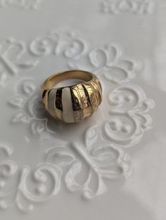 This beautiful statement is circa early 60s. It is gold plated croissant style ring with a white enamel stripe. I love this vintage but trendy piece that can be worn casually or out to a cocktail night with the girls.  This versatile piece is timeless yet trendy while being a unique ring to treasure for years to come. Formal White Enamel Rings, White Elegant Enamel Rings, White Enamel Elegant Rings, Elegant White Enamel Rings, Retro White Jewelry For Anniversary, White Retro Jewelry For Anniversary, Retro White Enamel Jewelry, White Retro Enamel Jewelry, Croissant Ring