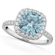 a blue diamond ring with diamonds around it