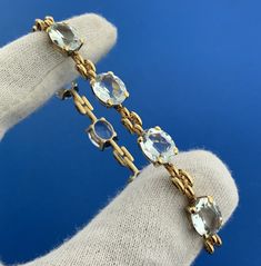 * Gorgeous 18k Yellow Gold Oval Aquamarine March Anniversary 7" Tennis Bracelet * Metal: 18k Yellow Gold * Stone(s): (8) Oval Cut Aquamarine Aquamarines measure approximately 10.0 x 8.0 mm each* Length: 7" * Width: 3/8" * Weight: 16.1 tgw * Markings: 18k * Condition: As pictured. * G2604 5% Restocking Fee    Exported By ExportYourStore :) Luxury Oval Gemstone Bracelet, Luxury Oval Tennis Bracelet As Gift, Luxury Gold Gemstone Bracelet For Formal Occasions, Formal Oval Gold Gemstone Bracelet, Formal Oval Gold Bracelet With Gemstones, Luxury Gold Bracelet With Gemstones For Formal Occasions, Oval Gold Gemstone Bracelet For Formal Occasions, Oval Gold Bracelet With Gemstone For Formal Occasions, Luxury Hand Set Oval Bracelets