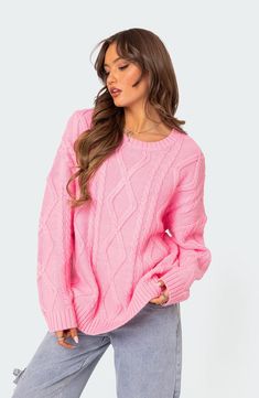 Classic cable stitches pattern a comfortably oversized sweater knit with dropped shoulders and a wide crewneck. Crewneck Long sleeves Dropped shoulders Ribbed cuffs and hem 100% acrylic Hand wash, dry flat Imported Oversized Cable Knit Sweater, Pink Oversized Sweater, Preppy Sweater, Stitch Sweater, Casual Preppy Outfits, Sweater Oversized, Sweater Oversize, Cable Stitch