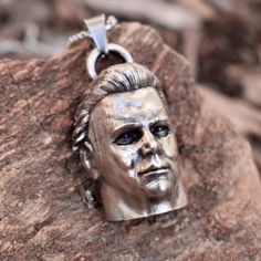 This stunning Michael Myers Halloween Inspired Pendant Necklace is Hand Made by me. Casted In sterling silver, it displays amazing detail and is sure to please anyone who is a fan of the films or villain. it comes with a 18 inch stainless steel chain. It is unisex and can suit anyone and would make an amazing gift! I am a one man show so it may take me some time but I will get these shipped as quickly as possible. As this is a handmade item there may be slight defects or ways it may slightly dif Halloween Engraved Metal Necklace, Gothic Hand-cast Halloween Necklaces, Silver Pendant Jewelry For Cosplay, Silver Necklaces For Halloween Cosplay, Silver Necklace For Halloween Cosplay, Engraved Halloween Pendant Jewelry, Halloween Engraved Sterling Silver Necklaces, Halloween Silver Stainless Steel Jewelry, Collectible Metal Jewelry For Halloween