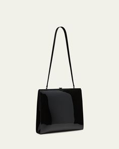 Saint Laurent "Le Anne Marie" shoulder bag in vinyl faux leather (polyurethane)    Shoulder strap, 11.8"L    Framed top with liftclasp closure     Golden hardware     Approx. 8.4"H x 11.4"W x 2.7"D    Made in Italy Designer Rectangular Satchel For Evening, Classic Formal Box Bag With Top Carry Handle, Designer Formal Bags With Glossy Finish, Luxury Bags With Glossy Finish For Formal Occasions, Designer Box Satchel For Evening, Designer Glossy Finish Bags For Formal Occasions, Luxury Glossy Formal Bags, Designer Glossy Finish Formal Bags, Luxury Glossy Finish Formal Bags