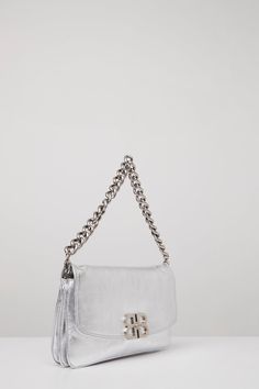 This bag from Balenciaga's Spring/Summer 2024 collection is in a silver peach calfskin with silver hardware. Luxury Rectangular Bag With Silver-tone Logo Plaque, Luxury Shoulder Bag With Silver-tone Logo Plaque, Rectangular Leather Shoulder Bag With Silver-tone Logo, Leather Top Handle Bag With Silver-tone Logo Plaque, Luxury Silver Shoulder Bag With Palladium Hardware, Luxury Satchel Shoulder Bag With Silver-tone Hardware, Luxury Shoulder Bag With Silver-tone Hardware, Chic Formal Shoulder Bag With Silver-tone Logo Plaque, Silver Rectangular Bag For Everyday Luxury