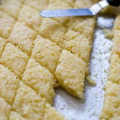 a close up of food on a pan with a spatula next to the top