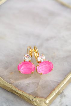 Vibrant Pink Crystal Earrings featuring electric neon pink drops, handmade with genuine Austrian crystals, are perfect as a standout gift for women and add a pop of color to any outfit! Details :  ● Materials- 14k Gold or Silver Plated over brass, Premium Quality Genuine Austrian Crystals. ● Lever-back style Earrings ● Size 26 mm x 14 mm  (1" x 0.55")  ● Color, Electric Neon Pink, White Clear Crystal ● Crystals - handset in secure prongs ● Nickel Free ● Bridal - Bridesmaid - Bulk Order Discounts Pink Earrings With Lever Back Ear Wires For Party, Pink Drop Earrings, Pink Crystal Earrings, Style Earrings, Bulk Order, Pink Crystal, Outfit Details, Gift For Women, Clear Crystal