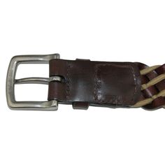 This striking and versatile 38mm braided belt adds a touch of personality and style to any casual or formal outfit. The silver-finish brass buckle stands out against the contrasting Full Grain leather lacing and cotton cord. Handcrafted in the USA with vegetable tanned leather. Made of Cotton and Leather Formal Leather Rope Belt, Classic Leather Rope Belt, Casual Braided Leather Belt, Casual Brown Belt With Brass Buckle, Classic Braided Leather Belt, Casual Leather Rope Belt, Casual Leather Belt With Brass Buckle, Brown Leather Rope Belt, Casual Leather Belts And Suspenders