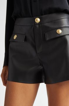 Step up your day-to-night looks with these high-waisted shorts cut from soft faux leather and finished with embossed goldtone buttons. Zip fly with button closure Front button-flap patch pockets 50% polyurethane, 50% polyester Dry clean Imported Leather Bottoms With Button Closure For Work, Workwear Faux Leather Shorts With Belt Loops, Faux Leather Workwear Shorts With Belt Loops, Faux Leather Shorts With Belt Loops For Work, Fitted Leather Shorts For Work, Chic Leather Bottoms With Button Closure, Luxury Workwear Shorts, Chic Workwear Shorts With Button Closure, Luxury Shorts With Belt Loops