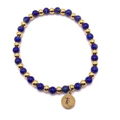 Blue Lapis Lazuli and Gold Beaded Stretch Bracelet Accented with 18K gold filled 4mm beads 4mm deep blue lapis beads Every bracelet I design is carefully thought out and crafted. Each individual bead is selected for its color, vibrancy, and size. I pay careful attention to how each bracelet lays on the wrist, how they nestle together as a stack, and how comfortable they are to wear together and individually. size: small 6.5" - 7"size: med 7" - 7.5" Gold Lapis Lazuli Beaded Bracelets With Round Beads, Hand-strung Gold Lapis Lazuli Bracelets, Gold Charm Bracelet With Gemstone Round Beads, Gold Beaded Lapis Lazuli Bracelets, Gold Lapis Lazuli Spiritual Bracelets, Gold Lapis Lazuli Bracelets For Gift, Lapis Lazuli Blue, Lapis Jewelry, Lincoln Nebraska