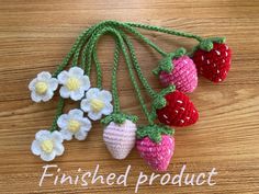 crocheted strawberries and flowers are hanging on a string with the words finished product written below