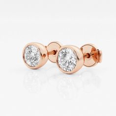 If you can't travel to Europe, then bring these classic European styled studs to you! These earrings have beautiful round lab grown diamonds set in a classic bezel setting. De rien?you're welcome! Classic 14k Rose Gold Round Earrings, Rose Gold Round Cut Lab Grown Diamond Earrings, Rose Gold Round Cut Lab-grown Diamond Earrings, Rose Gold Lab Grown Diamond Round Cut Earrings, Rose Gold Lab-grown Diamond Round-cut Earrings, Classic 14k Rose Gold Jewelry With Bezel Setting, Rose Gold Bezel Set Fine Jewelry Earrings, Classic Rose Gold Earrings With Single Diamond, Luxury Bezel Setting Round Cut Earrings