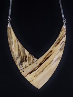 The necklace is one of a kind, handmade from Hackberry wood and has very smooth and brilliant surface. Stainless steel mesh chain 26 inch. Closure Lobster claw Care instructions: Avoid direct contact with perfumes, alcohol, water and other solvents that may damage wood finish. Wipe jewelry with soft dry cloth. Handmade Natural Wood Pendant Jewelry, Nature-inspired Natural Wood Jewelry With Variations, Nature-inspired Natural Wood Jewelry, Artisan Natural Wood Necklaces For Gift, Unique Handmade Natural Wood Jewelry, Artisan Natural Wood Necklace As A Gift, Artisan Necklaces In Natural Wood As Gift, Artisan Necklace In Natural Wood As A Gift, Artisan Natural Wood Pendant Necklace