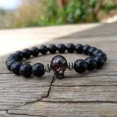 Skull Bracelet Onyx Gemstones and Sterling Silver Beads. Skull onyx bracelet with fine quality black onyx beads and sterling silver beads. An ideal gift for him. Length approx. 19 cm - can be adjusted upon request. Beads size 8mm ♥ All items will be delivered in a nice gift envelope to minimize shipping expenses for you!  You may choose gift wrapping at checkout if you wish! If you need it sooner, select expedited shipping at checkout and leave us a note with the wishing date! ★ Read our policie Black Gothic Skull Bracelet, Casual Black Bracelets For Halloween, Gothic Adjustable Black Beaded Bracelets, Gothic Black Adjustable Beaded Bracelets, Gothic Black Beaded Adjustable Bracelet, Black Beaded Gothic Bracelets, Gothic Black Beaded Bracelets, Bohemian Black Crystal Bracelet With 8mm Beads, Adjustable Gothic Skull Bracelets