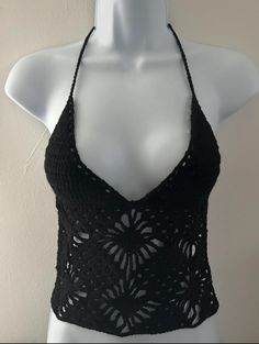 Turn heads with this stunning Backless Crochet Cami Top, the perfect blend of boho chic and modern style. This handcrafted top features intricate crochet patterns that offer a delicate, airy look ideal for warm weather. The elegant backless design adds a daring twist, making it a standout piece for any occasion. Pair it with your favourite high-waisted jeans or a flowing skirt for an effortlessly stylish ensemble. Whether you're heading to a festival, a beach outing, or a casual day out, this ba Bohemian Fitted Crochet Dress With Spaghetti Straps, Fitted Bohemian Crochet Dress With Spaghetti Straps, Sleeveless Lace Crop Top For Beach, Summer Beach Halter Cami Top, Lace Crop Top With Crochet Trim For Vacation, Summer Halter Neck Crochet Top For Party, Summer Beach Crochet Lace Top, Beach Lace Crop Top With Crochet Trim, Lace Crochet Trim Crop Top For Beach