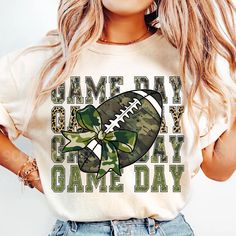 a woman wearing a camo football game day shirt