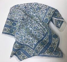 These sweet, lightweight kerchiefs are a shop favorite. Hand block-printed in India on a soft cotton with a rolled hem. 22"x22", 100% cotton. Machine wash cold, gentle cycle, air dry for longevity. Blue Cotton Bohemian Bandana, Blue Cotton Summer Scarves, Traditional Hand Printed Cotton Scarves, Traditional White Cotton Bandana, Rolled Hem, Cornwall, Air Dry, Block Print, India