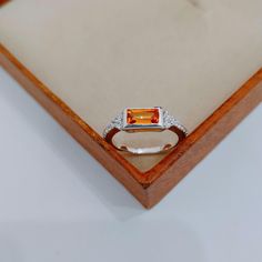 Main Stone : Lab grown orange Sapphire Stone Color : orange  Stone Size : 4*8 mm Stone Shape : baguette  Metal : 925 Sterling Silver Plating : Silver / Gold / Rose Gold Side Stone : American diamonds  Setting type : Bezel setting Occasion : Engagement, Wedding ,Party, Anniversary, Valentine's Day, Daily Gift for : Men & Women Both Style : Classic Rings Type : Wedding Bands Item Type : Ring If You Have Any Questions, Please Feel Free Contact Us through Etsy Message Service  If you want to make je Orange Sapphire Ring, Baguette Cut Ring, Orange Stone, Ring Sapphire, Daily Gift, Orange Sapphire, Sapphire Engagement Ring, Diamond Settings, Sapphire Stone