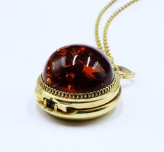 Vintage European gold tone & dome faux amber locket watch pendant necklace 199 Vintage European gold tone and dome faux amber locket watch pendant necklace, In good worked condition, The chain 17" long, Watch pendant  25 mm across 15 mm thick. Amber 20 mm across. Thanks, Watch Pendant, Pretty Accessories, Vintage European, European Vintage, Locket Necklace, Locket, Necklace Etsy, Amber, Gold Tones