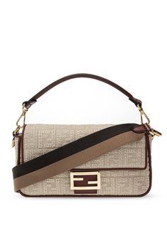 Beige and brown ‘Baguette’ shoulder bag from Fendi. Crafted from canvas with jacquard FF motif, this design fastens via magnetic snap-button and employs leather trims, gold-tone metal hardware including logo plaque on the front, a detachable and adjustable shoulder strap and interior with one compartment and one zip pocket. Size: Medium Country of Origin: Italy Fendi Baguette Bag, Fendi Purses, Tods Bag, Compact Bag, Fendi Baguette, Baguette Bag, Suede Fabric, Fendi Bags, Nappa Leather