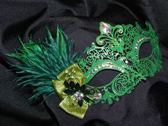 Intricate mid sized green lightweight laser cut metal fretwork accented with AB gemstones for added glam and sparkle, feathers, ribbon and a rhinestone piece in shades of green.   Mask is attached to ribbons for ease in hands free wearing, perfect for the bride, bridesmaid or party girl.   This mask can also be made in almost any color.   Contact me for a custom order, they are my specialty!  Please take note that if you are outside the US please contact me and I will add the option with the price for the shipping to your country.