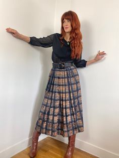 Vintage 80s does 50s circle midi skirt with pleats in a plaid pattern with floral overlay in shades of black, brown, dark gray and copper. Designed by Meico - Landhaus Look. Shown here on a size FR 36 / UK 8 / US 2 / S model 172 cm / 5'8" height, it fits but is a bit big in the waist. This skirt would best fit a FR 36-42 / UK 8-14 / M-L depending on your desired fit, but please verify all measurements to be sure. Waist: 33-43cm  - 13-17in (elastic in back of skirt) Hips: open Overall Length: 89c Vintage Pleated Skirt For Fall, Vintage Fall Pleated Skirt, Vintage Full Pleated Skirt For Fall, Vintage Full Skirt With Accordion Pleats, Vintage Accordion Pleats Skirt For Fall, Vintage Plaid Full Skirt, Vintage Pleated Plaid Skirt, Vintage Pleated Skirt For Workwear In Fall, Vintage Pleated Fall Skirt For Workwear