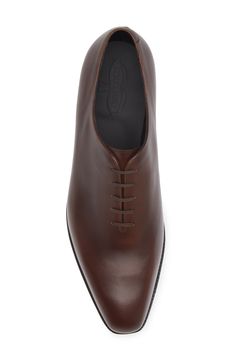 Expertly crafted from a single piece of smooth leather, this polished oxford is constructed with Goodyear welting, so it can be easily resoled if needed. Lace-up style Leather upper and lining/rubber sole Made in Portugal Designer Shoes Semi-formal Bridle Leather Oxfords With Almond Toe, Timeless Brown Oxfords With Leather Lining, Classic Brown Dress Shoes With Goodyear Welt, Classic Cognac Oxfords For Business, Classic Italian Crafted Dress Shoes For Business, Classic Italian Business Dress Shoes, Classic Cognac Dress Shoes With Goodyear Welt, Timeless Brown Derby For Business, Timeless Brown Derby Shoes For Business