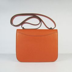 The material is a beautiful leather which is very chic and durable.The color on this bag is complemented with palladium (Silver-toned) or goldtone hardware.This is THE bag for the Hermes connoisseur.The bag is opened and closed using the magnetic closure in the front - letter 'H'.The interior is lined with soft evercalf leather and features 2 compartments.Each compartment has a side pocket. The exterior also features a side pocket.This is a VERY VERY understated bag. Definitely classic and can b Modern Cognac Satchel With Palladium Hardware, Cognac Epsom Leather Bag With Palladium Hardware, Modern Cognac Shoulder Bag With Palladium Hardware, Rectangular Epsom Leather Shoulder Bag With Silver-tone Hardware, Luxury Cognac Saddle Bag For Office, Modern Office Saddle Bag With Palladium Hardware, Cognac Satchel With Palladium Hardware, Designer Cognac Bag With Silver-tone Hardware, Luxury Cognac Satchel With Palladium Hardware