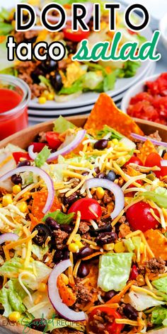 mexican salad with lettuce, tomatoes, black olives and corn on the side