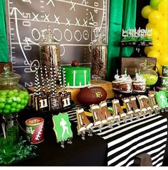 a football themed party with green and black decorations