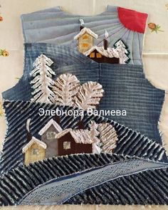 a piece of fabric with houses and trees on it