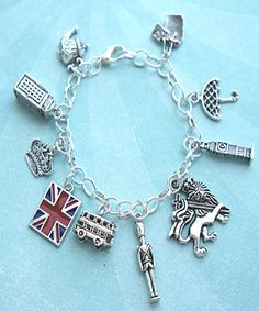 this charm bracelet features London inspired Tibetan silver charms(nickel free). the charms are attached to a silver tone 7.5 inches chain bracelet Symbolic Charm Bracelet With Dangling Charms, Symbolic Metal Charm Bracelet With Dangling Charms, Themed Sterling Silver Charms, Themed Silver Sterling Charms, Nickel Free Silver Themed Charms, Silver Symbolic Bracelets With Dangling Charms, Symbolic Silver Bracelets With Dangling Charms, Themed Silver Metal Charms, Symbolic Silver Bracelet With Dangling Charms