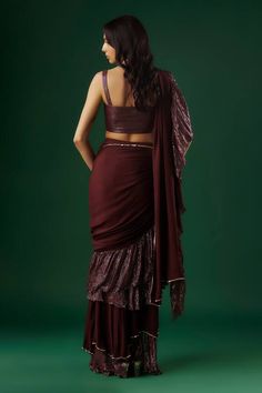 Wine tiered-textured pre-draped ruffle saree with placed sequin embellishments. Comes with padded textured blouse. - Aza Fashions Party Draped Sharara In Georgette, Party Wear Draped Georgette Sharara, Party Wear Draped Sharara In Georgette, Party Draped Georgette Sharara, Party Wear Draped Sharara With Cutdana, Party Sharara With Cutdana And Draped Design, Diwali Pre-draped Saree With Ruffles, Diwali Draped Pre-draped Saree With Ruffles, Elegant Draped Choli With Ruffles