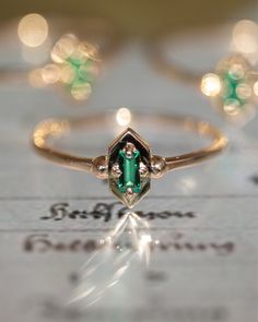 ✪ Limited Edition. Lucky Green Elixir Ring in 14K solid gold. Cleopatra's favorite stone, the... Gold And Emerald Jewelry, Emerald Baguette Ring, Baguette Ring, Lucky Green, Ring Sizer, Emerald Jewelry, Green Emerald, Bright Green, Emerald Green