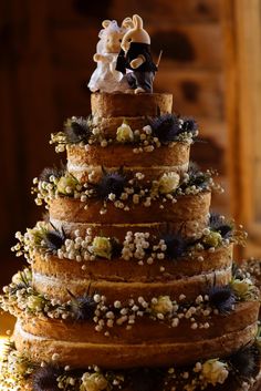 a three tiered wedding cake decorated with flowers