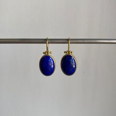 Striking blue Afghanistan lapis lazuli cabochons rest serenely within pristine gold bezels to make an effortlessly regal pairing. 18k yellow gold Lapis lazuli, 9.4ctw, 9mm x 13mm (3/8" x 1/2") Earrings hang 15/16" from the ear Each earring weighs 2.4g Lapiz Lazuli Jewelry, Lapis Earrings, Lapis Lazuli Earrings, 2 Earrings, Newport Ri, Pretty Jewellery, Lapis Lazuli, Vintage Inspired, Polymer Clay