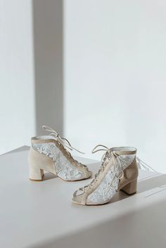 a pair of shoes sitting on top of a white table