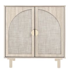 a white cabinet with two doors and an oval design on the door, in front of a