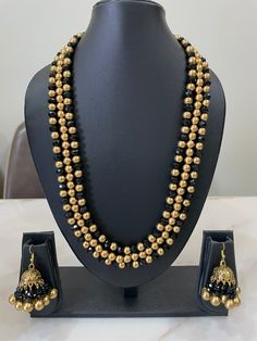 3-layer Bore Maal, made in India - Handmade Jewlery. Looks beautiful. Traditional Gold Beads With Black Details, Festive Gold Beaded Necklaces With Black Beads, Traditional Gold Beads For Party, Gold Beads For Party And Festivals, Elegant Gold Beads For Festive Occasions, Gold Beaded Necklaces With Black Beads For Weddings, Handmade Jewlery, Golden Beads, Wedding Necklaces