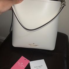 White Kate Spade Bucket Bag, Super Spacious, Brand New Elegant Bucket Bag With Handles For Errands, Formal White Rectangular Bucket Bag, Chic White Bucket Bag For Office, Trendy White Kate Spade Bag, Elegant White Bucket Bag For Errands, Kate Spade Bucket Shoulder Bag With Detachable Strap, Elegant Bucket Bag With Detachable Strap For Errands, Kate Spade Everyday Bucket Shoulder Bag, Kate Spade Bucket Bag With Detachable Strap