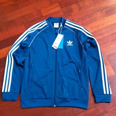 Nwt, Good Condition, Never Use Blue Hooded Outerwear With Three Stripes, Casual Blue Adidas Outerwear, Adidas Blue Track Jacket For Streetwear, Blue Three Stripes Track Jacket For Fall, Adidas Three Stripes Winter Outerwear, Adidas Three Stripes Spring Outerwear, Blue Adidas Track Jacket For Spring, Adidas Blue Track Jacket For Spring, Adidas Winter Track Jacket With Ribbed Cuffs